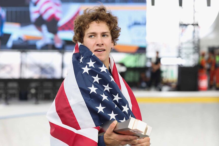 Jagger Eaton is wrapped in an American flag.