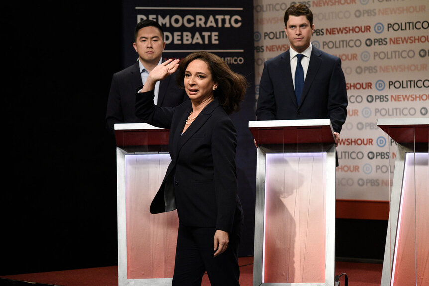 Bowen Yang as Andrew Yang, Maya Rudolph as Kamala Harris, and Colin Jost as Pete Buttigieg during the "Democratic Debate" Cold Open