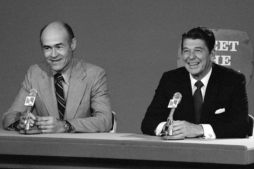 NBC News' moderator Bill Monroe and presidential candidate Ronald Reagan at the "Meet The Press" desk in 1976.