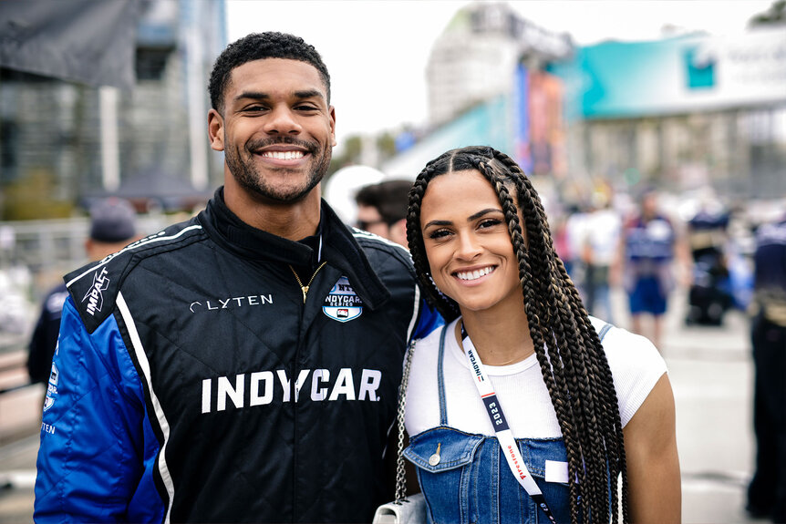 Andre Levrone Jr. and Sydney McLaughlin-Levrone attend the Indy car Experience at the 2023 Acura Grand Prix Of Long Beach