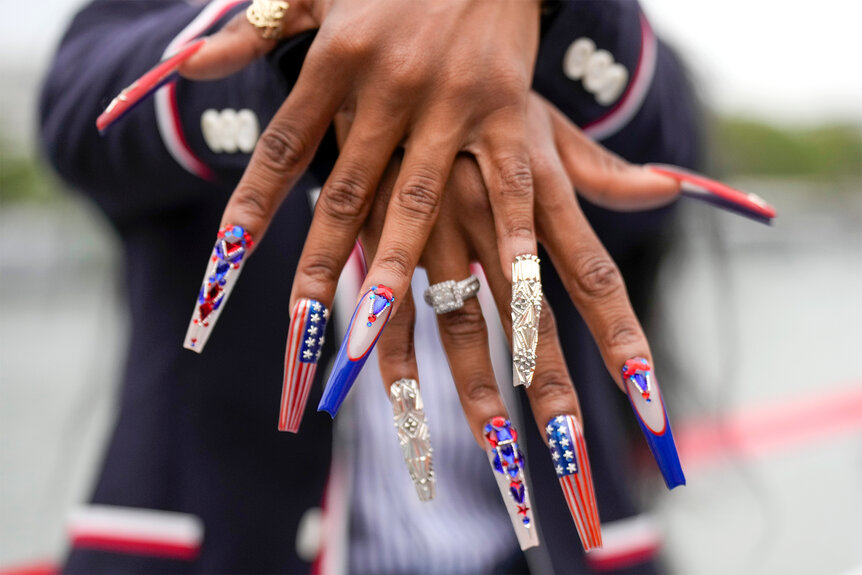 Sha"Carri Richardson showing her 2024 olympic nails off