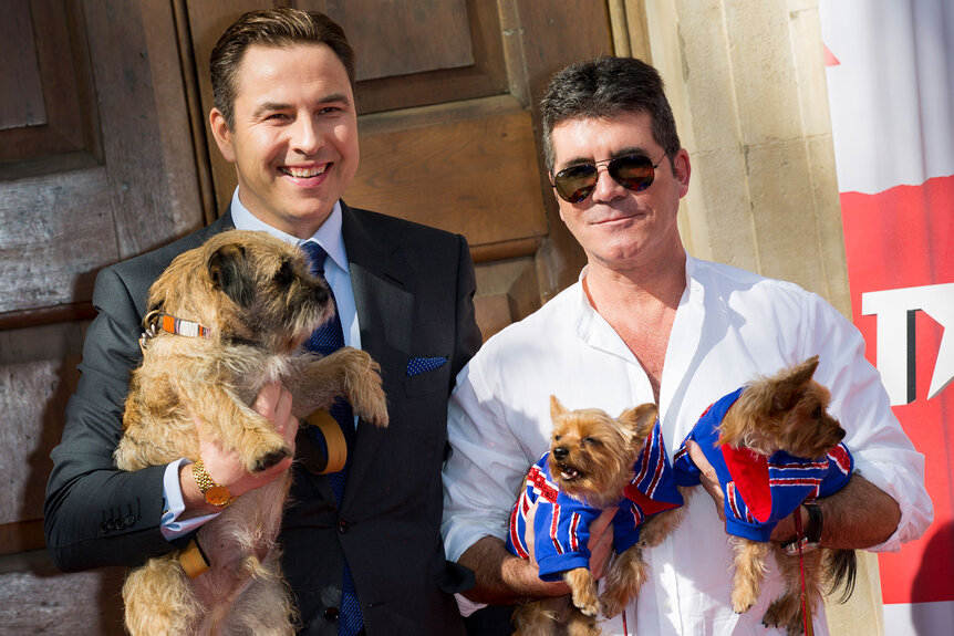 David Walliams, Simon Cowell, and their dogs attend a photocall for "Britain's Got Talent"