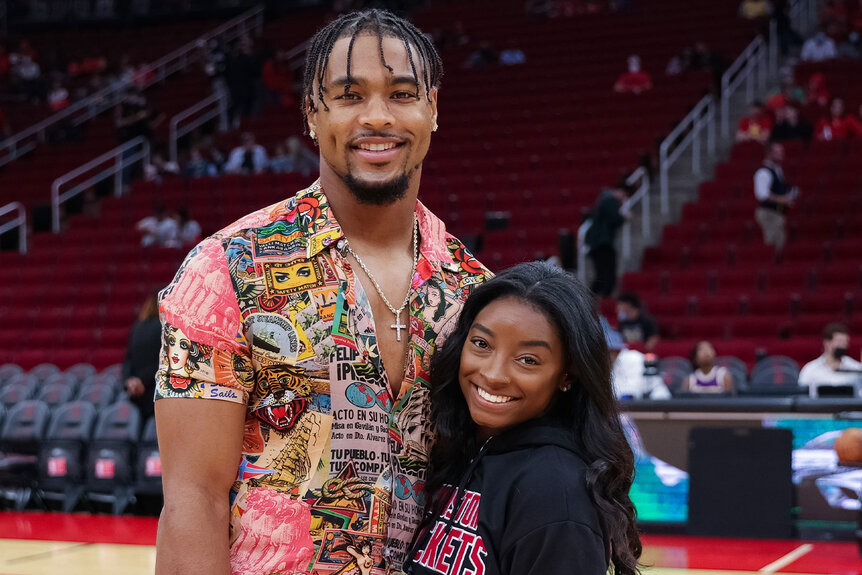 Simone Biles and Jonathan Owens attend an NBA game