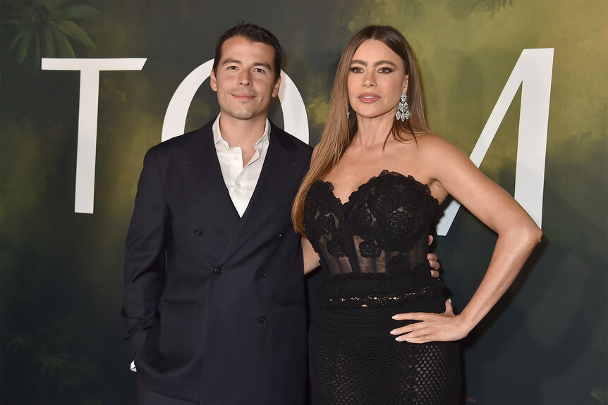 Sofia Vergara and her son Manolo Gonzalez Vergara pose together in a black suit and black dress