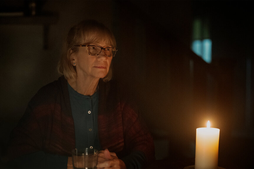 Ellen wears glasses in front of a candle on Teacup