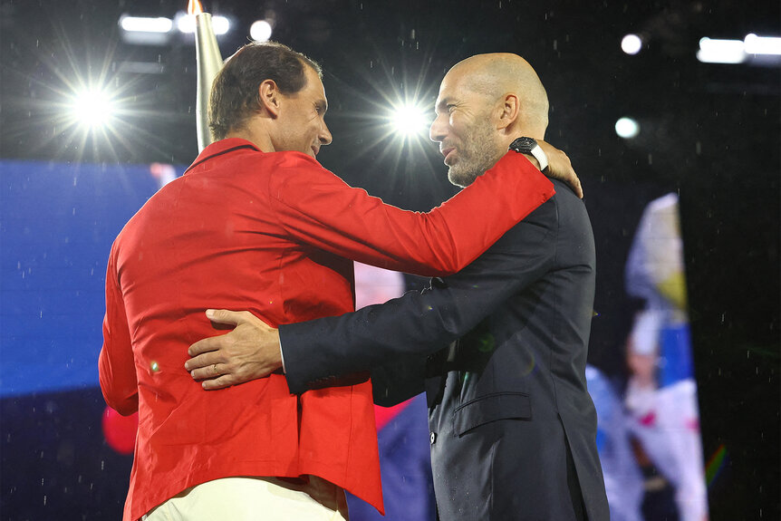 Zinedine Zidane passes the torch to Rafael Nadal at the 2024 Olympics Opening Ceremony