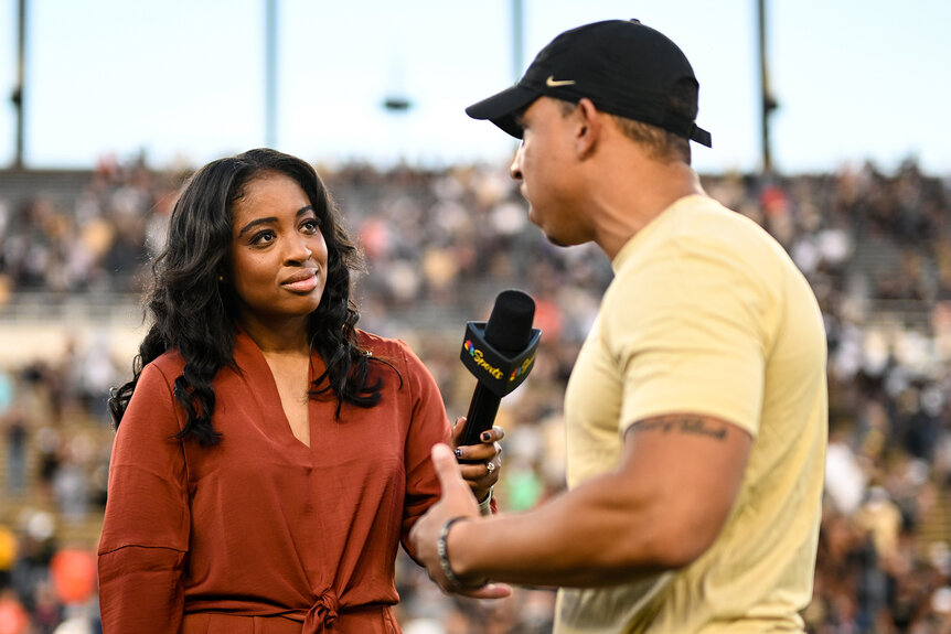 Zora Stephenson interviews Ryan Walters after a college football game