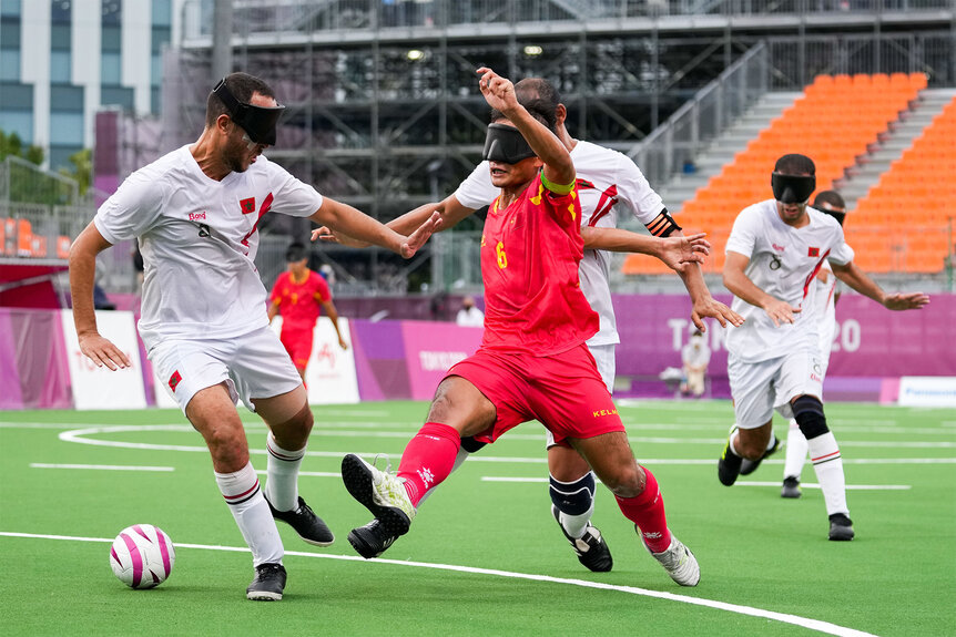 China and Morocco play soccer on the pitch at the 2020 Paralympic Games