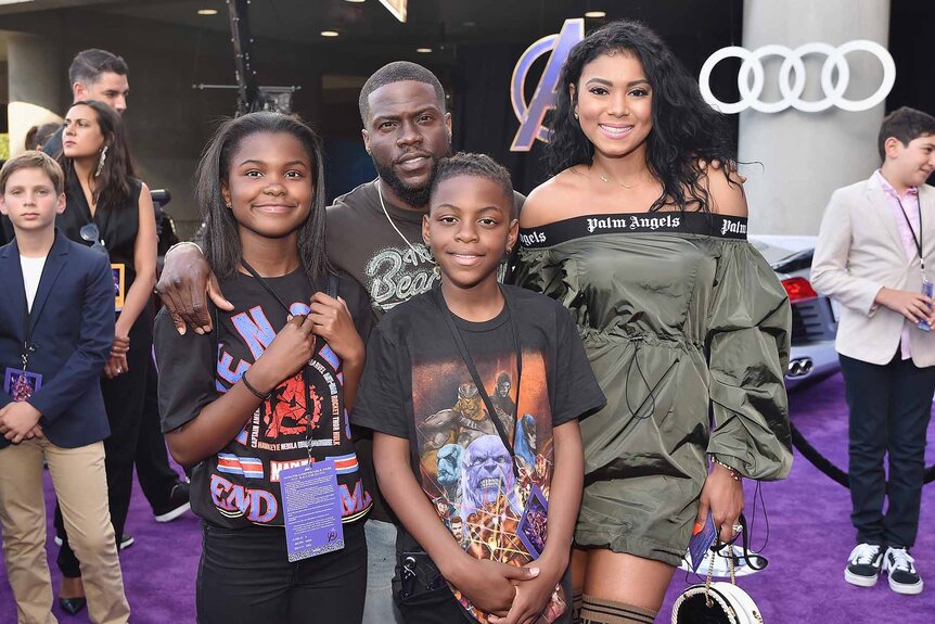 Kevin Hart poses with his wife and children.