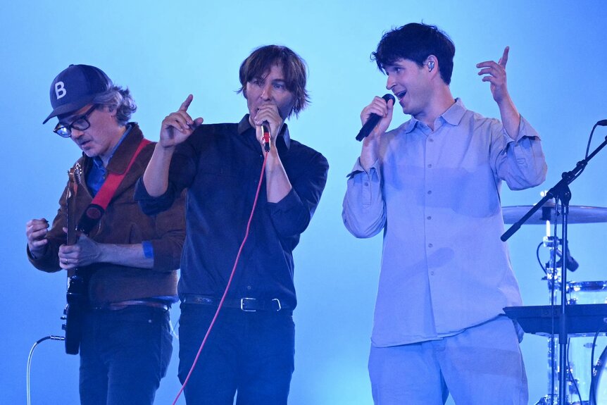 Phoenix and Ezra Koenig perform during the Olympic Closing Ceremony