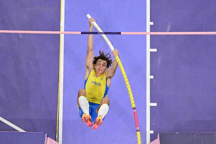 Armand Duplantis competing in the pole vault athletics event at the Paris 2024 Olympics.