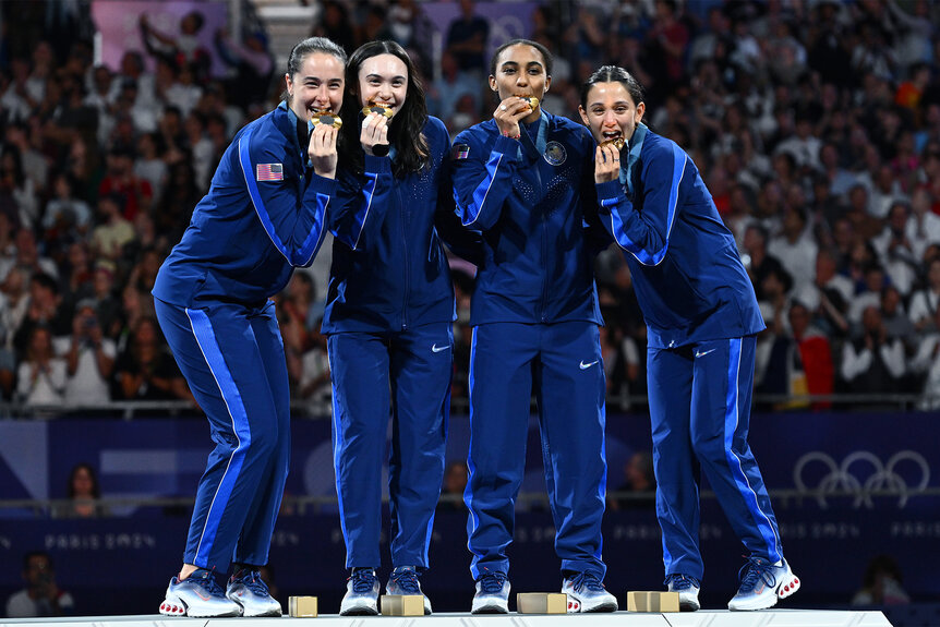 USA's Fencing team celebrates after winning gold at the 2024 olympics