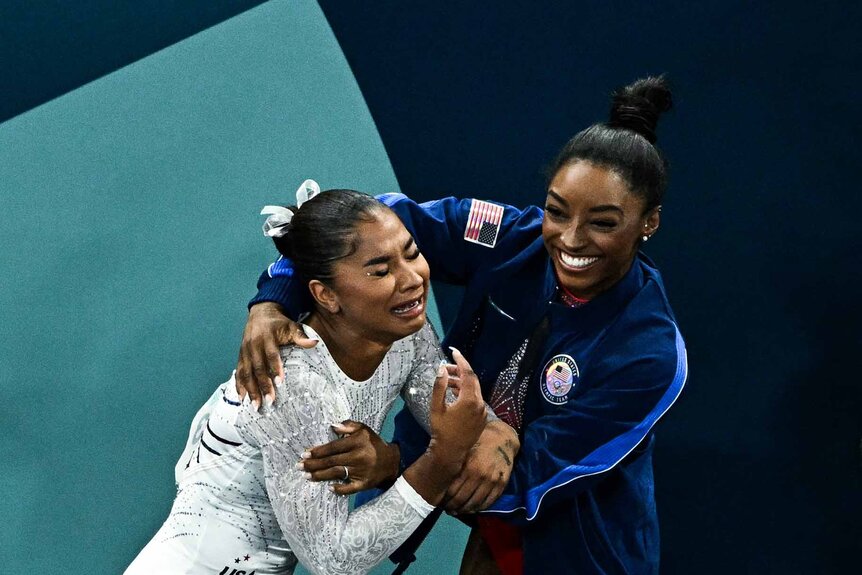 Simone Biles and Jordan Chiles celebrate together at the 2024 Paris Olympics.