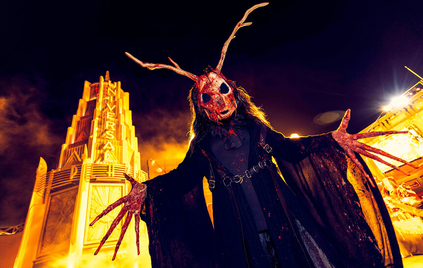 A person dressed in a costume at Halloween Horror Nights.