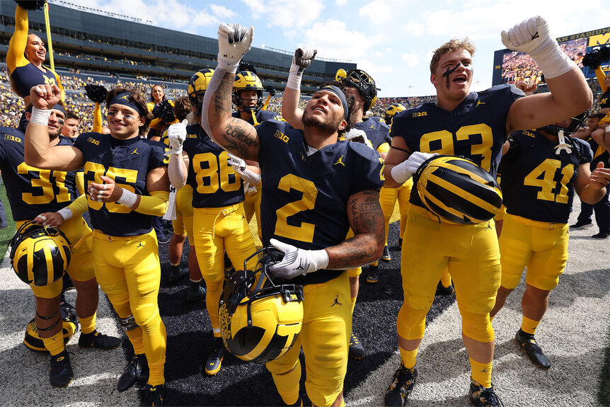 Blake Corum of the Michigan Wolverines celebrates a 31-7 win over the Rutgers Scarlet Knights