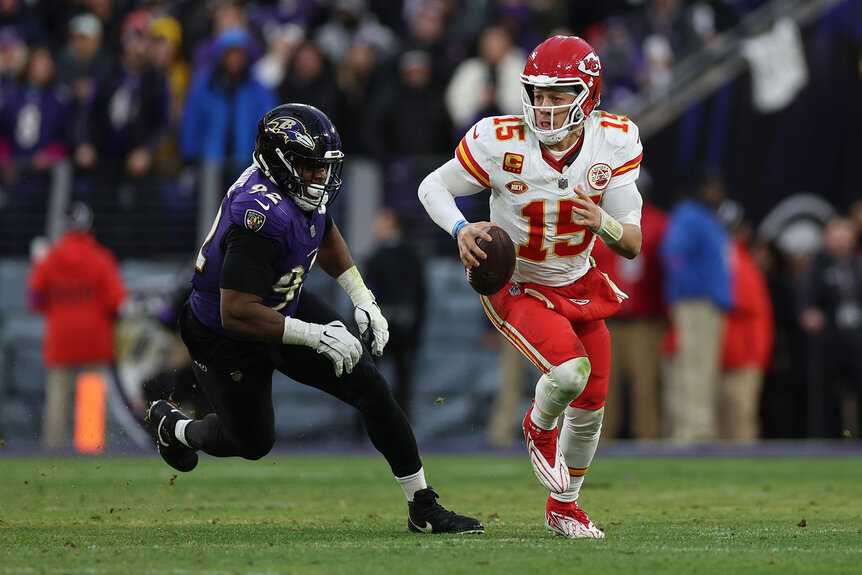 Patrick Mahomes #15 of the Kansas City Chiefs rushes with the ball against the Baltimore Ravens