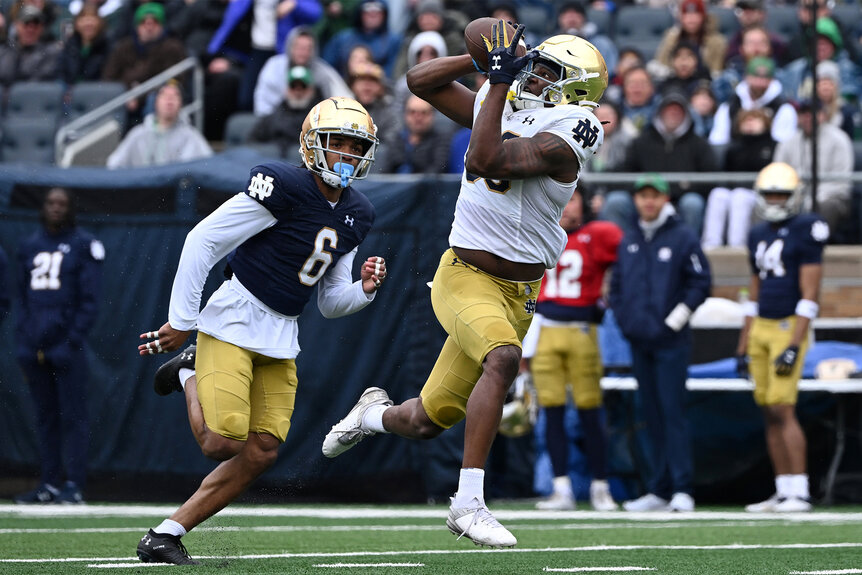 Jayden Thomas of Notre Dame Fighting Irish catches the football during a play