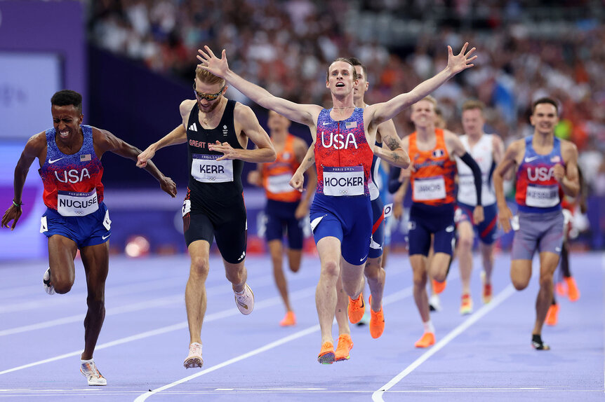 Cole Hocker, Josh Kerr, and Yared Nuguse cross the finish line at the 1500m final at the Paris 2024 Olympics.