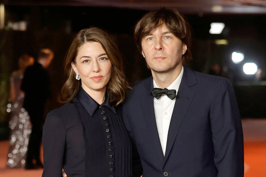 Sofia Coppola and Thomas Mars embrace each other on the red carpet