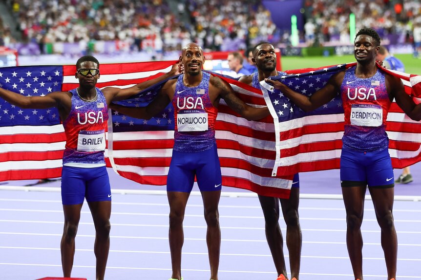 The U.S. celebrates a gold medal in the men's 4x400 relay at the 2024 Olympics