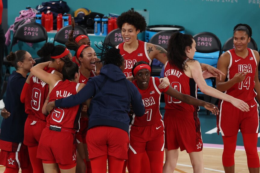 The U.S. Women's Basketball team celebrates their gold medal at the 2024 Olympics