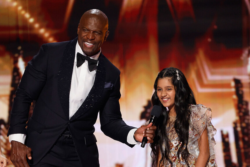 Terry Crews and Pranysqa Mishra onstage during America's Got Talent