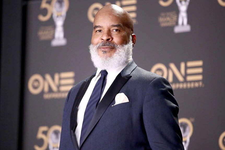 David Alan Grier wears a blue suit on the red carpet at the 50th NAACP Image Awards