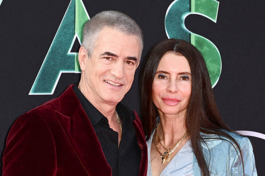 Dermot Mulroney and Prima Apollinaare on the red carpet for "Secret Invasion" at El Capitan Theatre