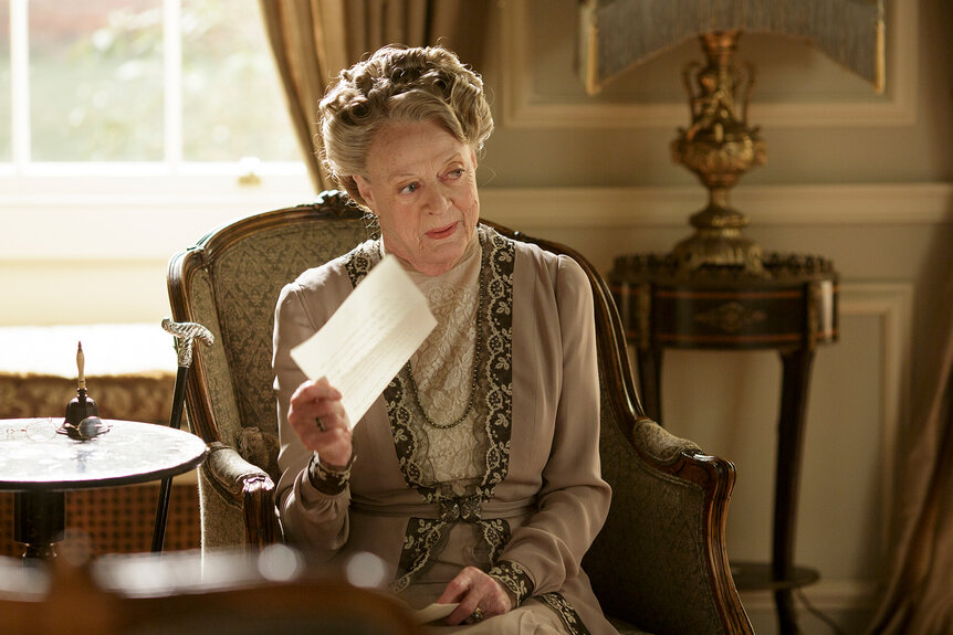 Violet holds up a piece of paper on Season 6 of Downton Abbey.