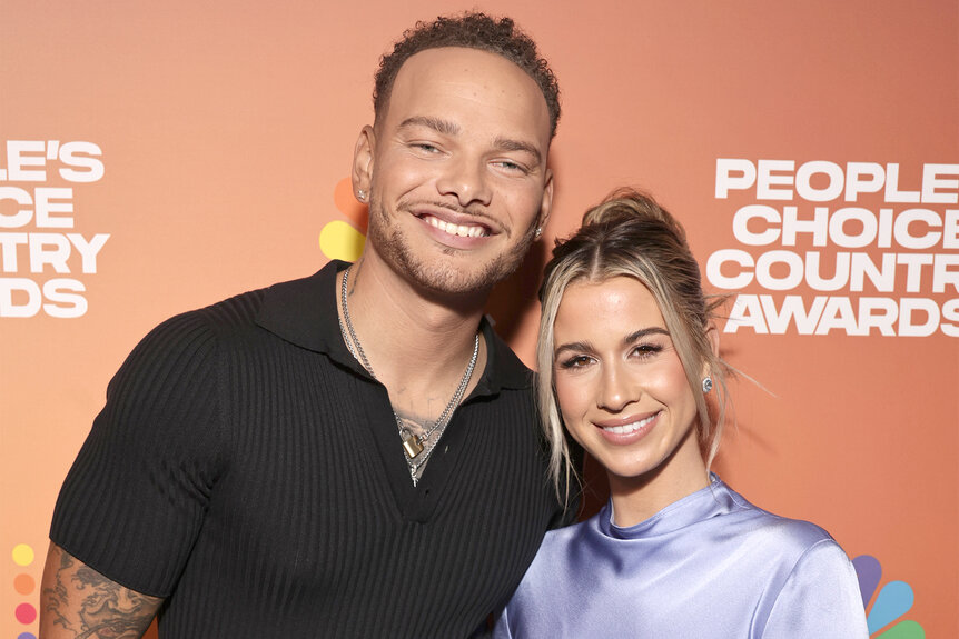 Kane and Katelyn Jae Brown smile on the red carpet at the 2023 People's Choice Country Awards