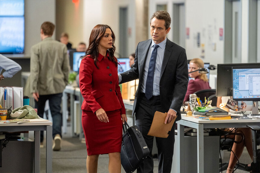 Assistant District Attorney Samantha Maroun (Odelya Halevi), and Assistant District Attorney Nolan Price (Hugh Dancy) speak while standing in the office