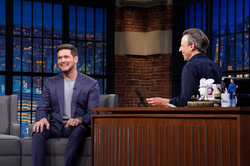 Michael Bublé smiles towards the audience during an interview with Seth Meyers