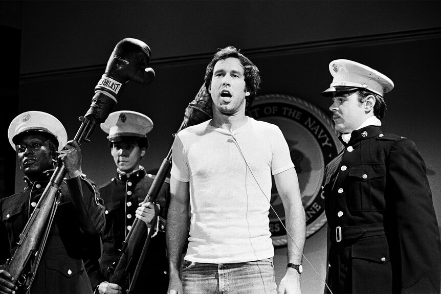 Chevy Chase during a sketch on SNL in 1976