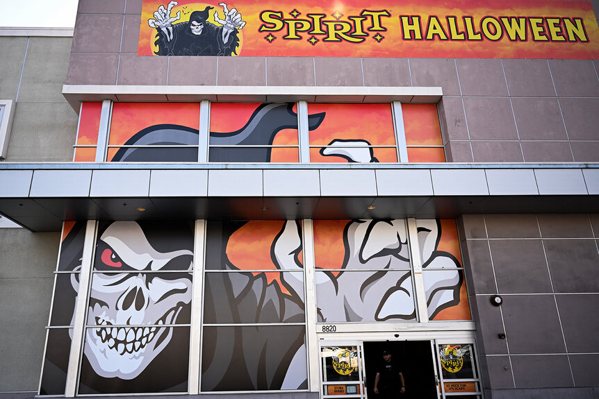 A view of the windows of a Spirit Halloween store front