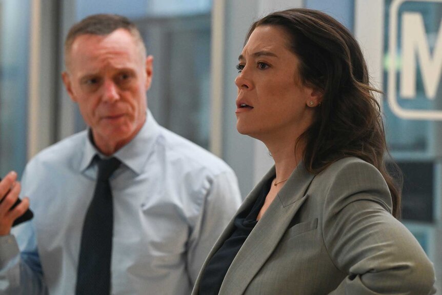 Hank Voight looks at Asa Chapman while she talks on Chicago P.D. Season 12 Episode 4.