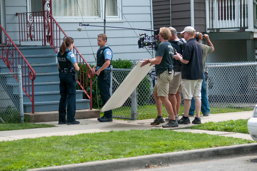 The crew filming Chicago PD outside of a house on Chicago P.D Season 3 Episode 2