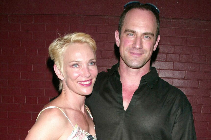 Christopher Meloni and Sherman Williams stand in front of a red brick wall