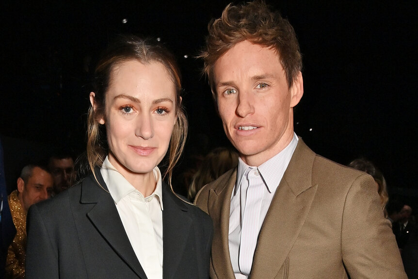 Hannah Bagshawe and Eddie Redmayne pose together during fashion week