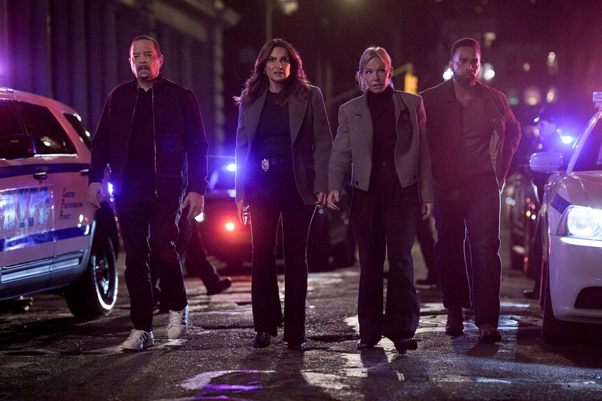 Amanda Rollins, Olivia Benson, Fin and Corgan walk past police cars on Law and Order SVU Season 26 Episode 3