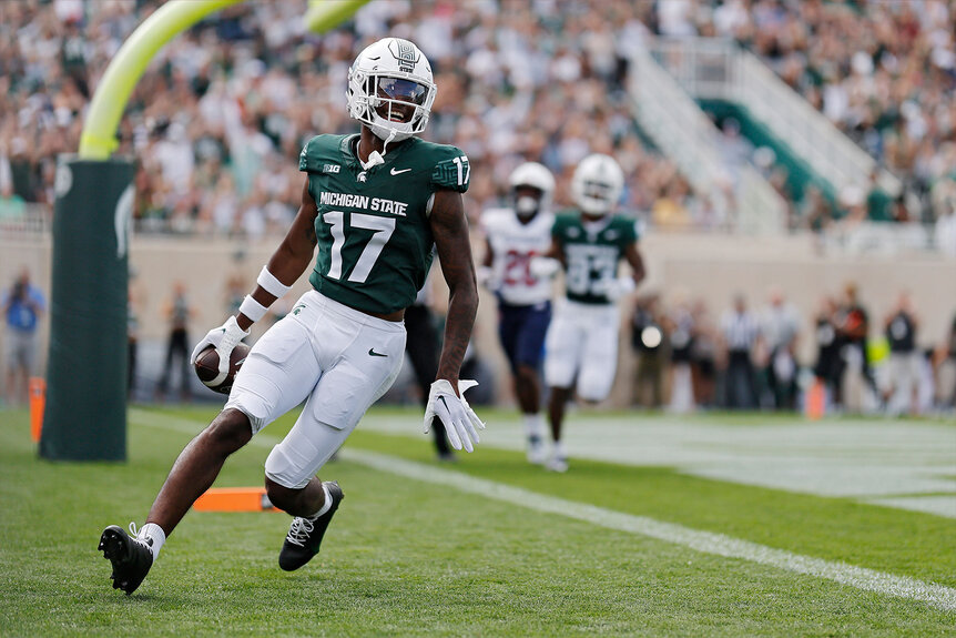 Tre Mosley #17 of the Michigan State Spartans celebrates a touchdown in the first quarter of a game against the Richmond Spiders