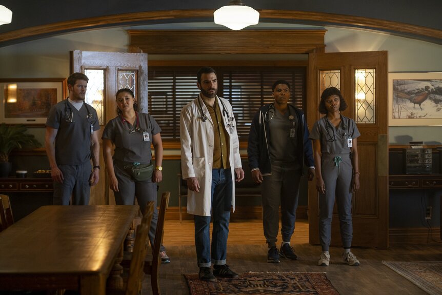 The cast wears nurses scrubs and a doctor's coat in Brilliant Minds Episode 106,