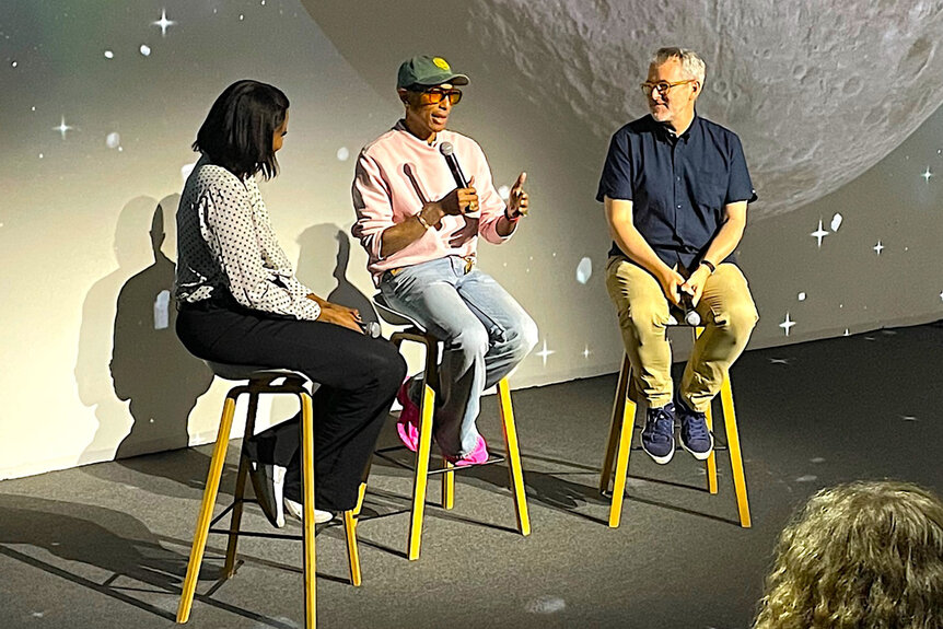 Pharrell Williams sits on stage for a Piece By Piece Q&A Event