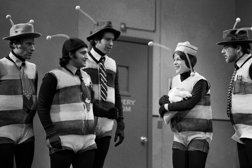 George Coe as bee, John Belushi as bee, Chevy Chase as bee, Gilda Radner as bee, Michael O'Donoghue as bee during the "Bee Hospital" skit on SNL