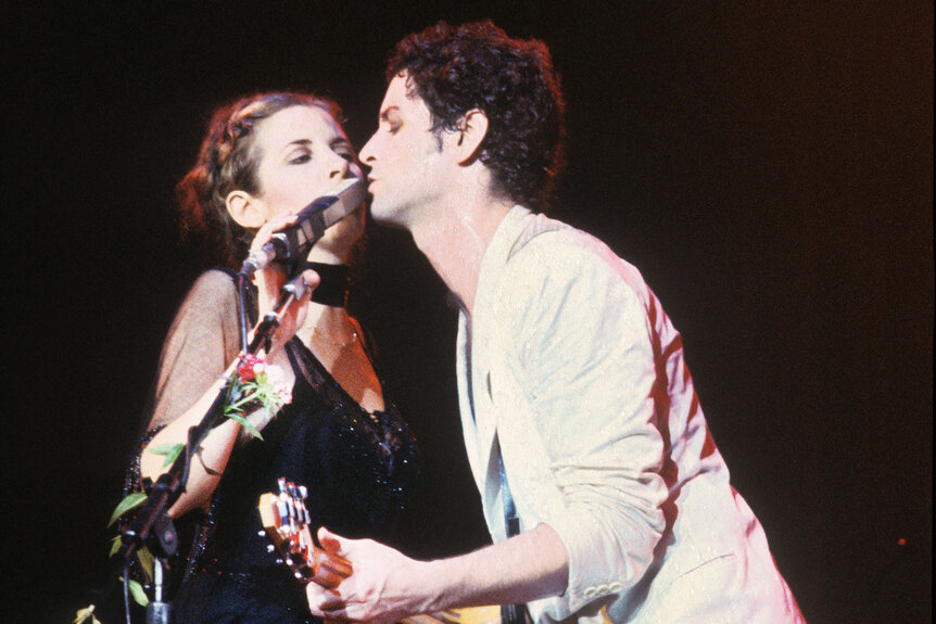 Stevie Nicks and Lindsey Buckingham share a mic onstage in Brussels, Belgium in December 1980.