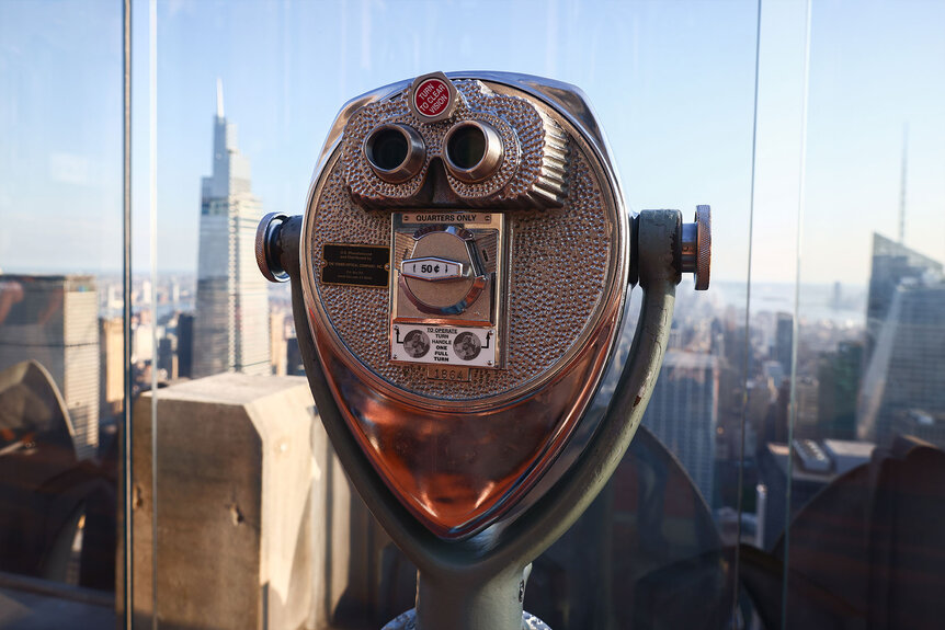 A telescope at the Top of the Rock NYC Observation Deck of Rockefeller Center building