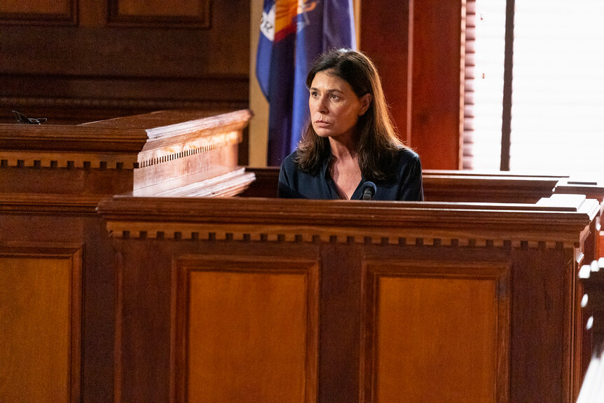 Lt. Jessica Brady sits in the witness stand in court on Law & Order Season 24 Episode 8.