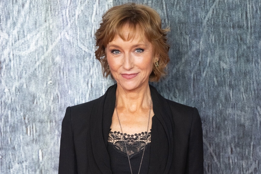 Lia Williams wears a lace black top and black blazer on the red carpet