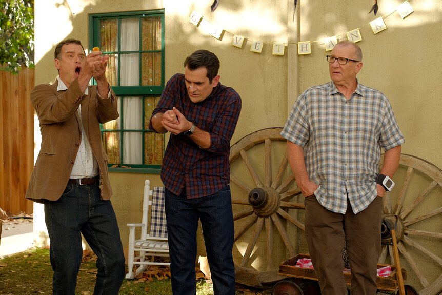 Jerry, Phil and Jay stand outside of a house on modern family season 8 episode 7