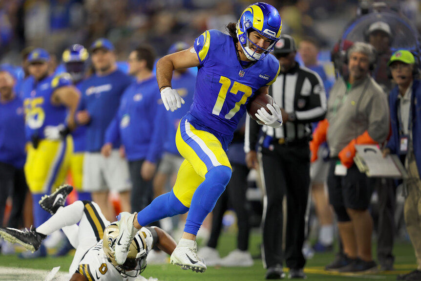 Rams wide receiver Puka Nacua rushes for yardage against the Saints