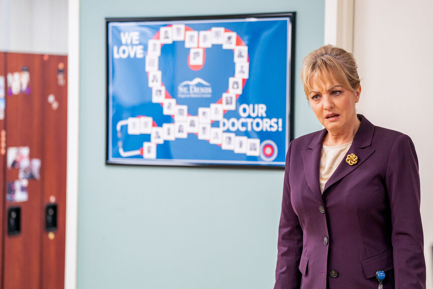 Joyce wears a purple blazer on St. Denis Medical Season 1 Episode 1